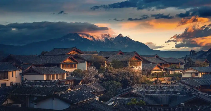 Panoramic aerial view of the traditional tiled roofs in Lijiang Old Town.